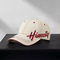 Embroidered letter baseball cap by Trendsi featuring a classic design with colorful embroidered letter on front, adjustable strap at back.