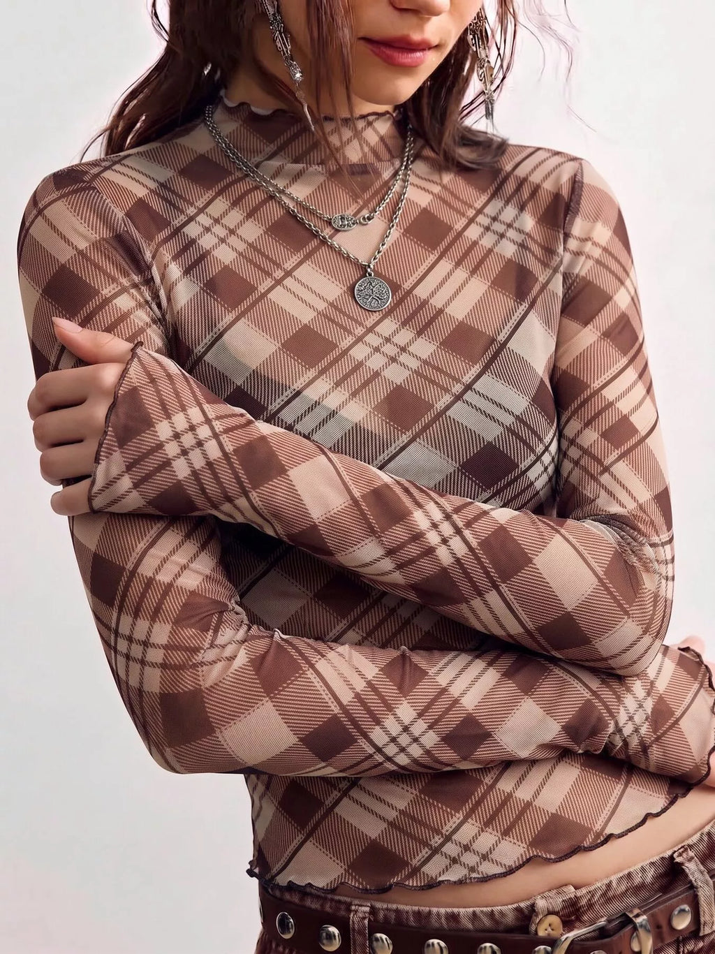Sheer mesh plaid mock neck long sleeve T-shirt from Trendsi featuring a lightweight, see-through fabric with a stylish pattern.