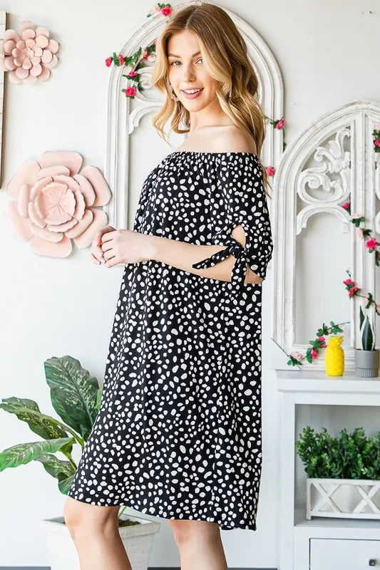 Heimish full-size short sleeve off-shoulder animal print mini dress, plus size, with a relaxed fit and stylish design.
