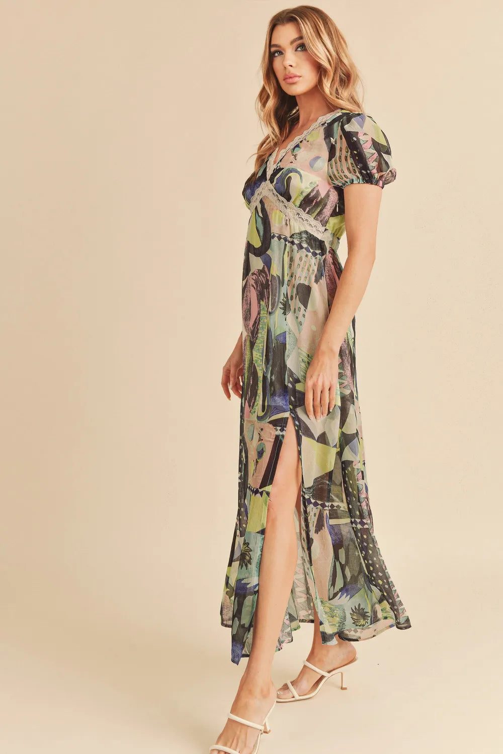 Aemi + Co lace detail slit geometric print short sleeve maxi dress by Trendsi, featuring a flowing silhouette and stylish pattern.