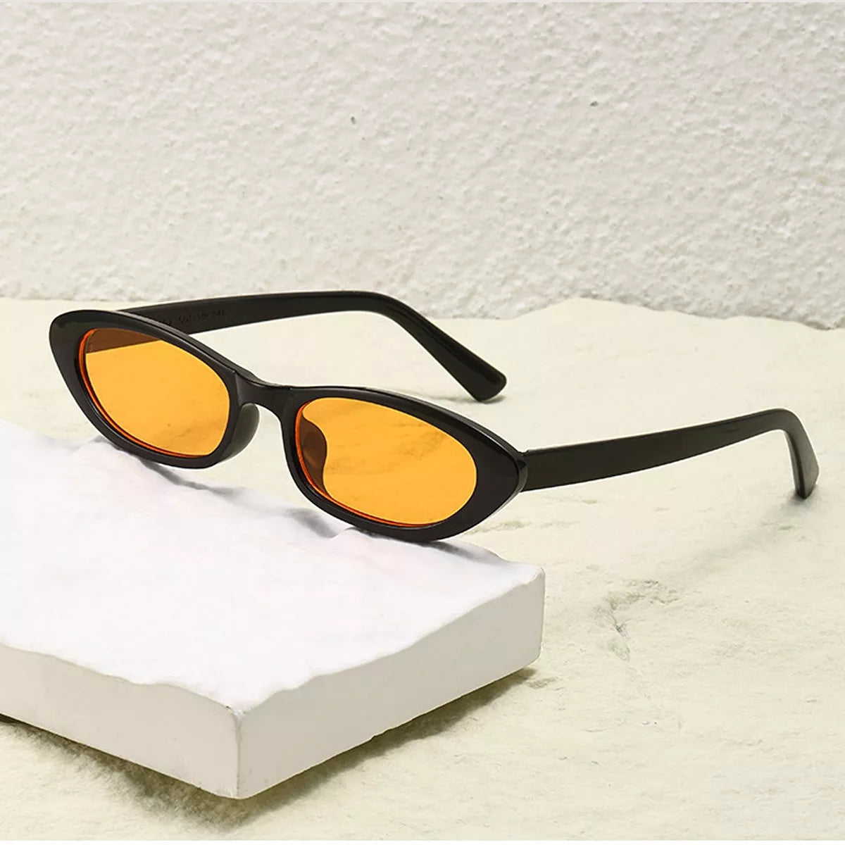 Vintage oval frame sunglasses by Trendsi featuring classic design and tinted lenses for stylish sun protection.