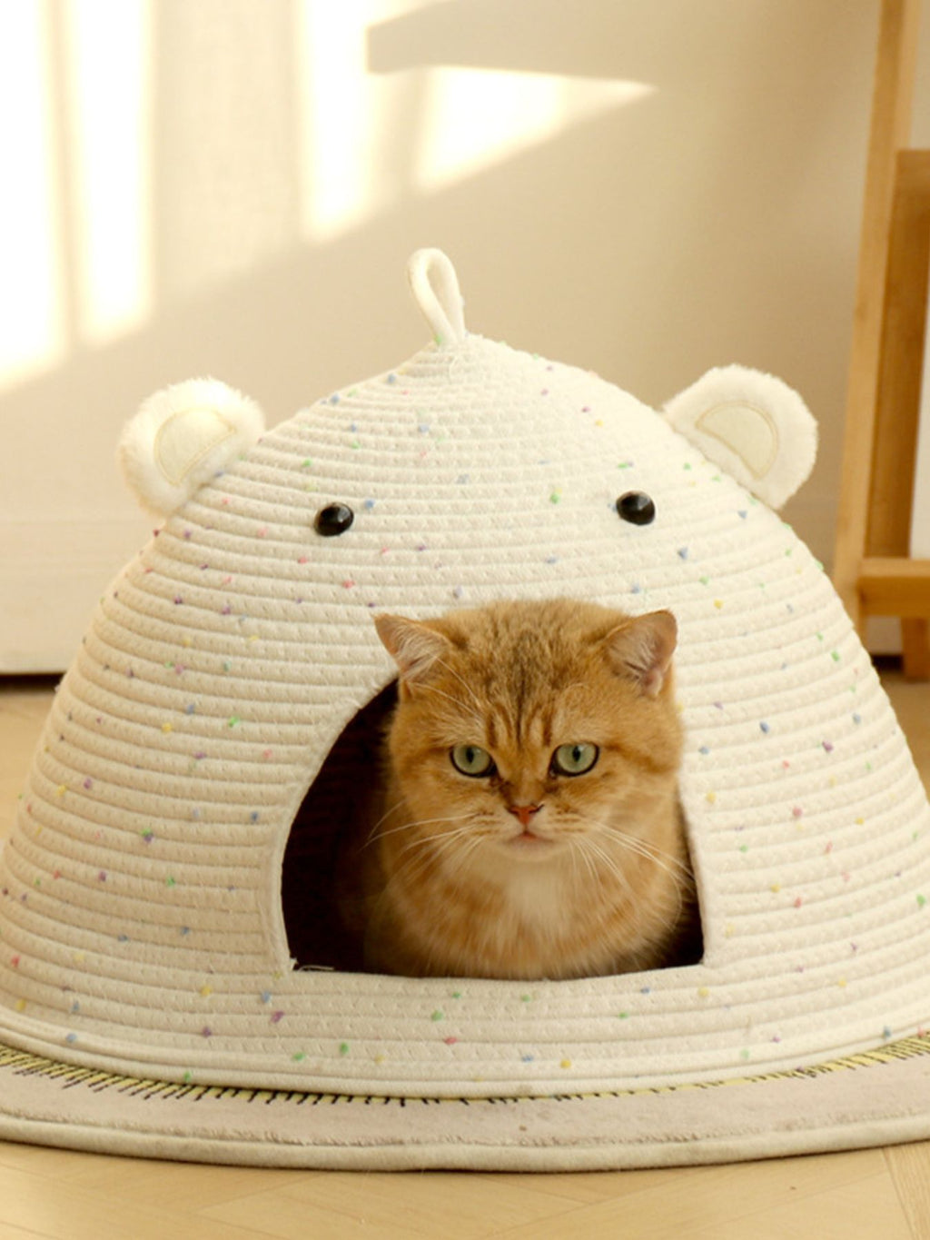 Woven pet nest with bear ear design from Trendsi, cozy and soft for small pets like cats or small dogs.