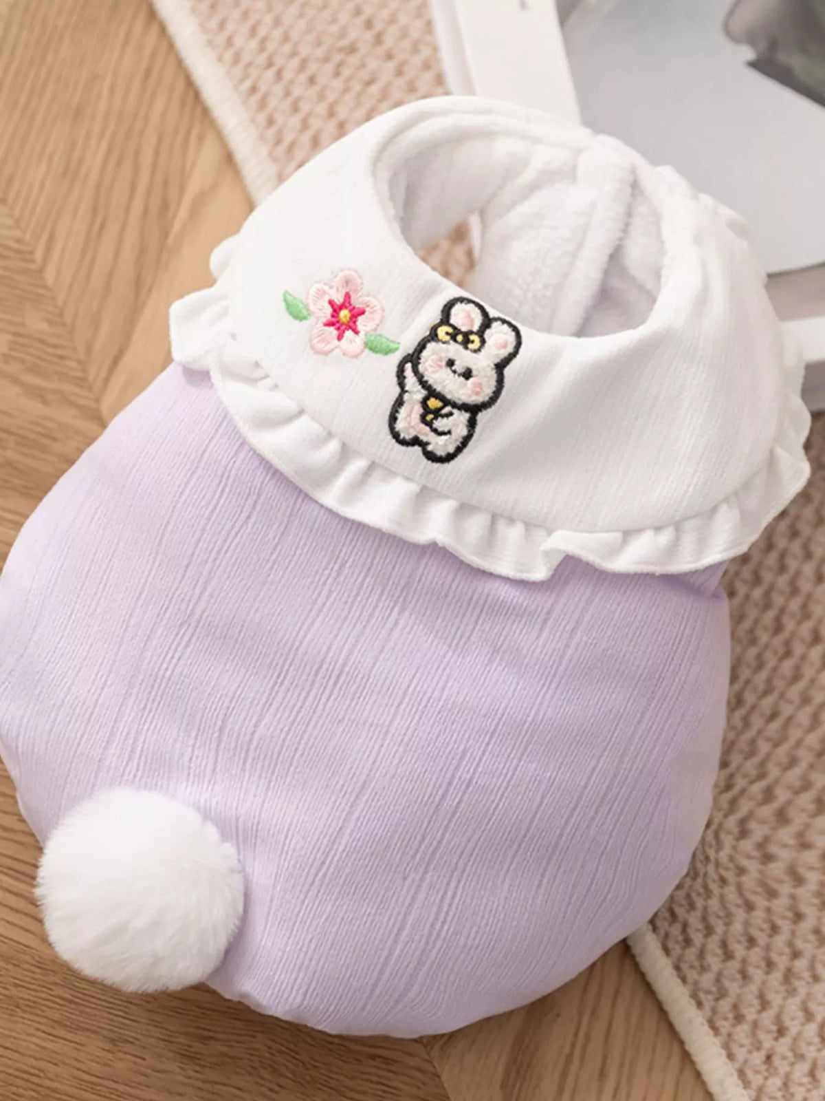 Button-down pet jumpsuit with ruffle collar from Trendsi, featuring a stylish design and comfortable fit for pets.