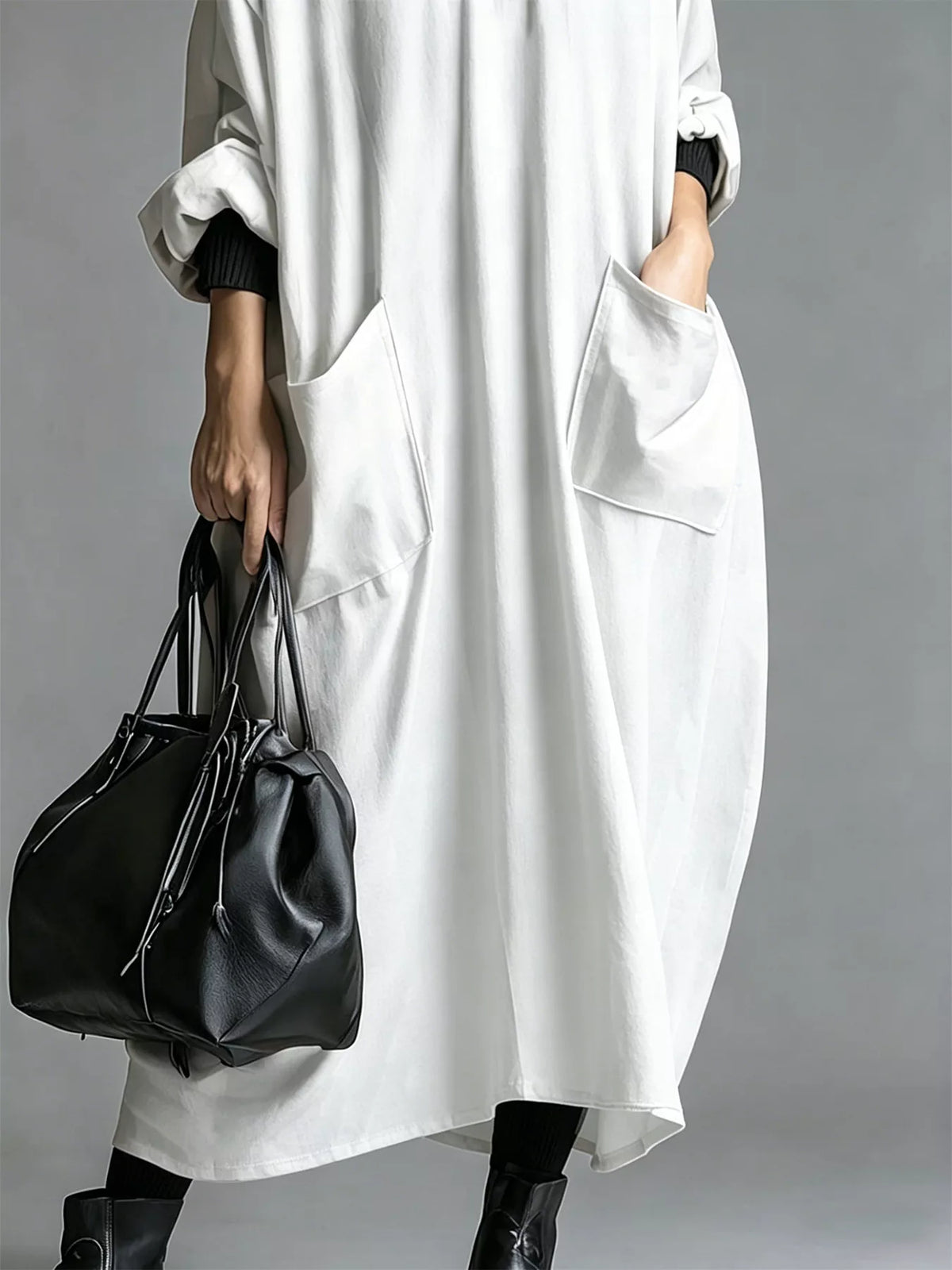 Plus size loose-fit mock neck midi dress with pockets by Trendsi, shown in a full-size, stylish and comfortable design.
