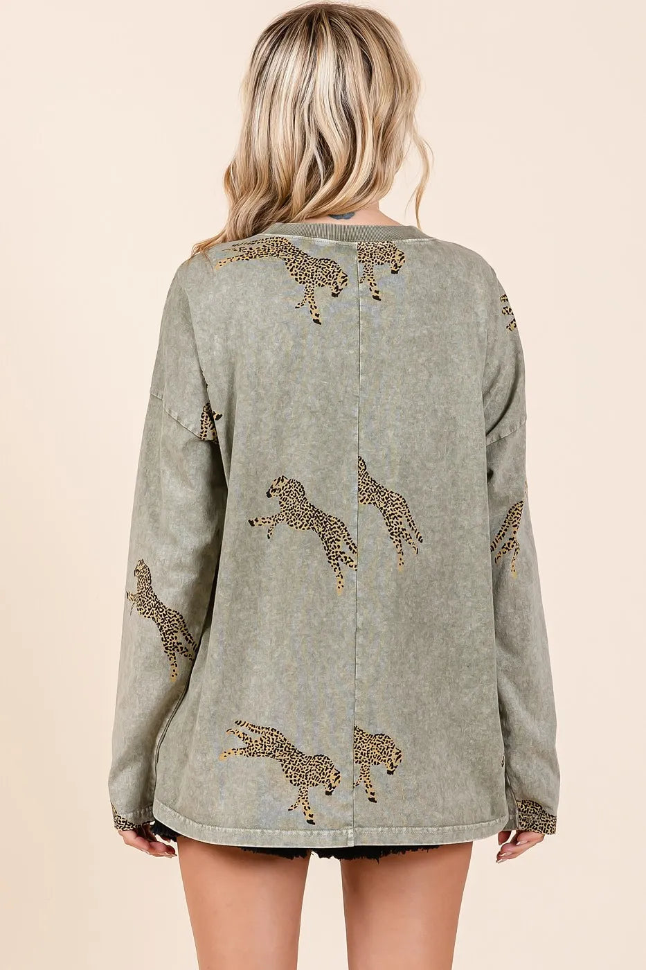 Mineroshop mineral wash cheetah print long sleeve top with a relaxed fit, featuring bold animal print and soft fabric for casual wear.