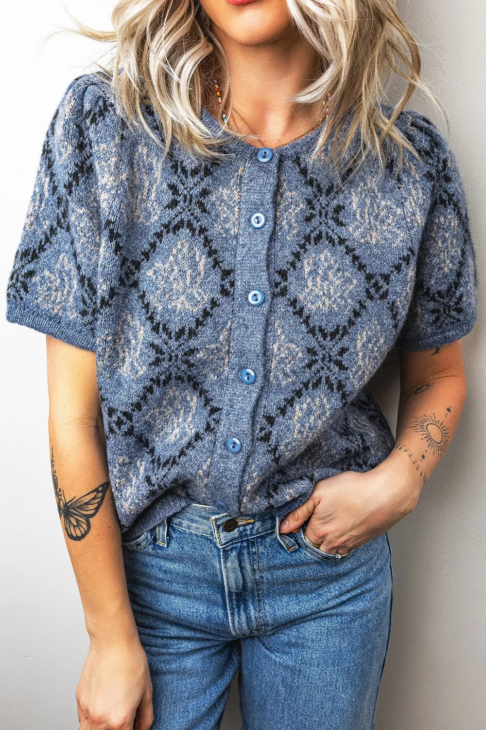 Short sleeve boho knit cardigan with button front, trendy casual top by Trendsi, shown in a relaxed fit with intricate knit pattern.