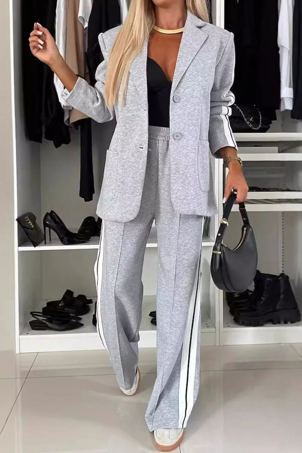 Full size contrast lapel collar top and pants set by Trendsi, featuring a stylish, coordinated outfit with a modern design.