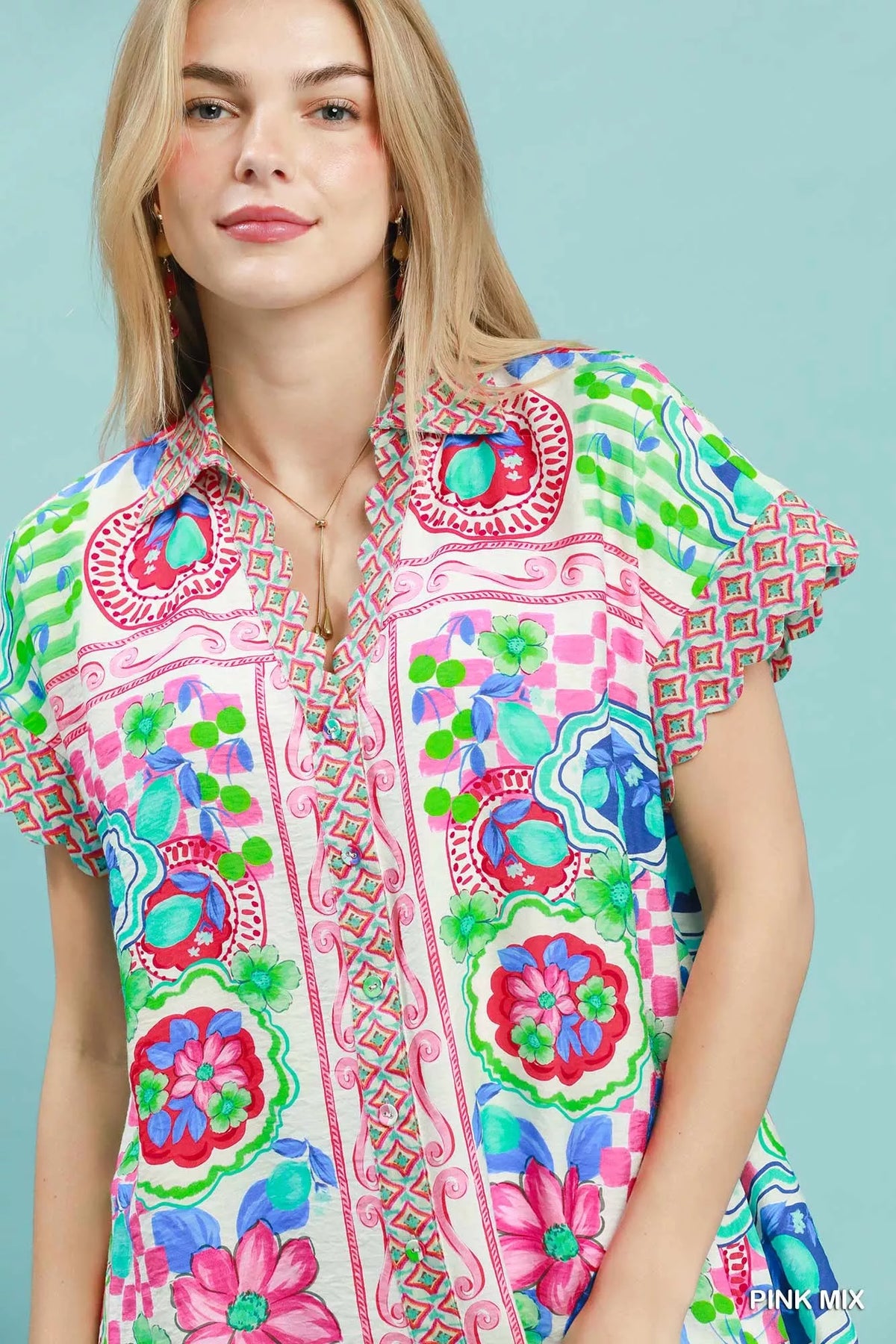 Umgee Mediterranean print dress with contrast printed trim, featuring a flowy silhouette and vibrant design, ideal for casual wear.