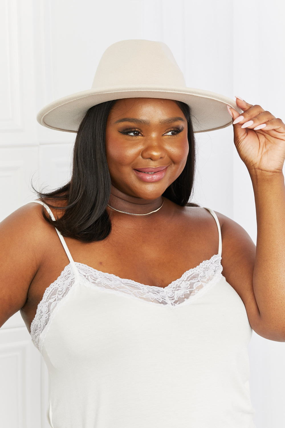 Trendsi Fame Ride Along Fedora Hat with a wide brim and classic design, shown in a neutral color, perfect for stylish outdoor wear.