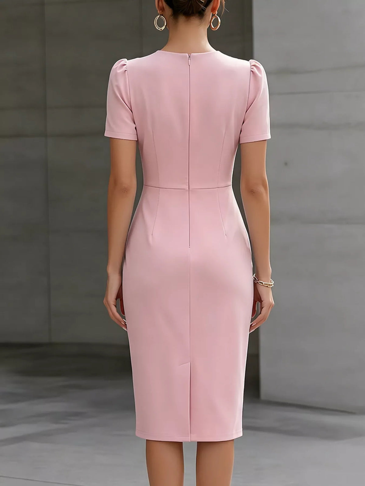 Ruched short sleeve midi dress by Trendsi, featuring a fitted design, soft fabric, and stylish neckline, worn by a model.