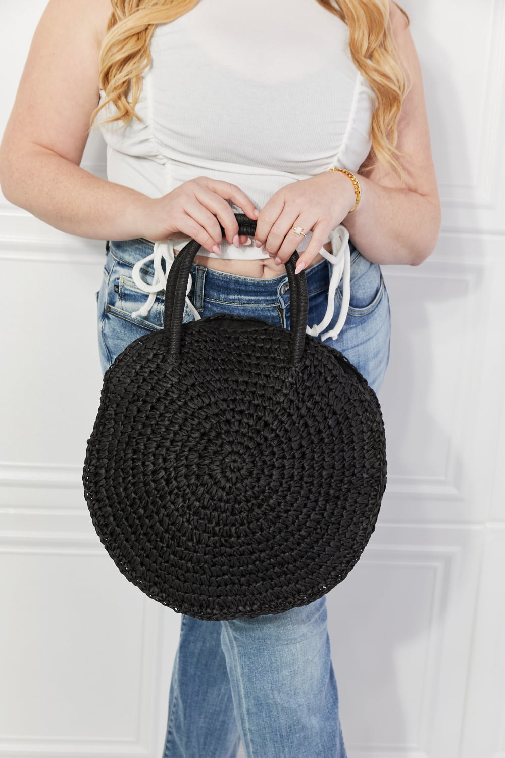 Justin Taylor Beach Date Straw Rattan Handbag in black with woven rattan design and black leather accents for summer style.