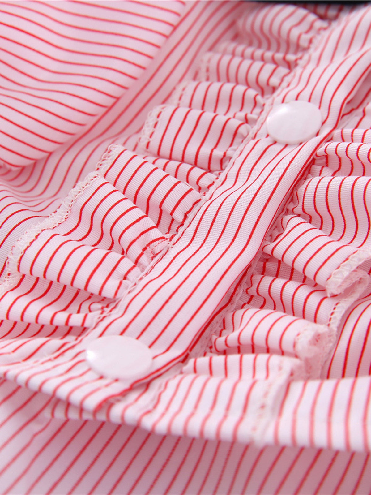 Striped ruffle pet top with bow from Trendsi, featuring a colorful pattern and stylish design for small dogs or cats.