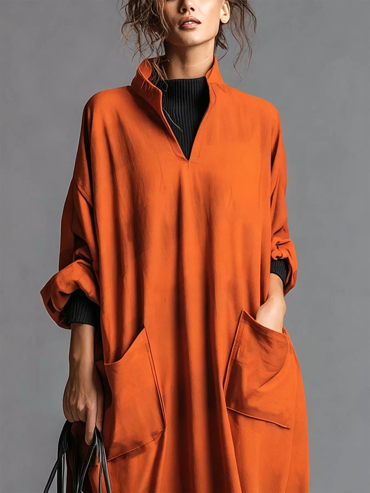 Plus size full-length loose-fit mock neck midi dress with pockets by Trendsi, shown in a comfortable, casual style.