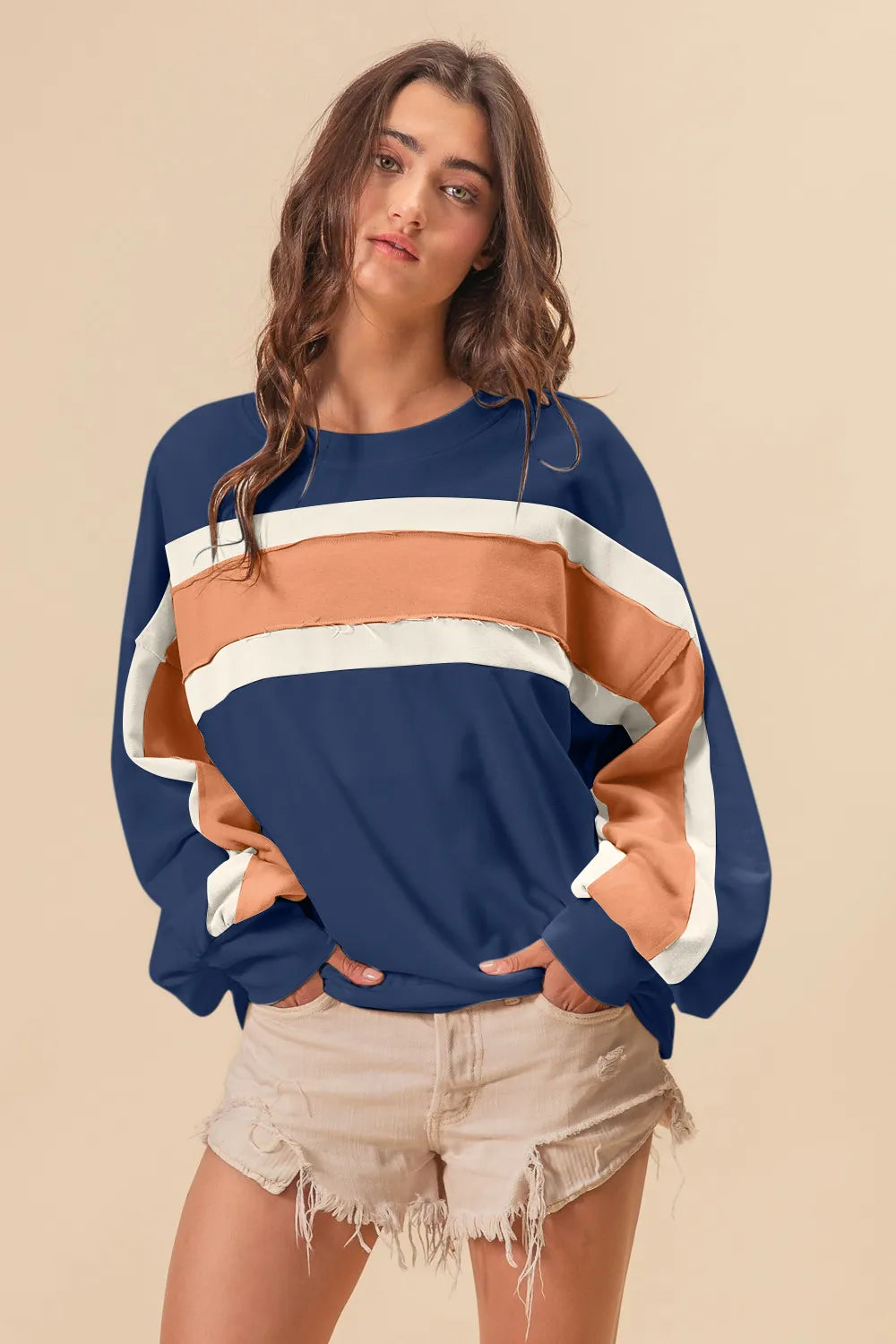 BiBi French Terry color block sweatshirt with cut edge details, casual trendy sweatshirt by Trendsi, soft and stylish for everyday wear.