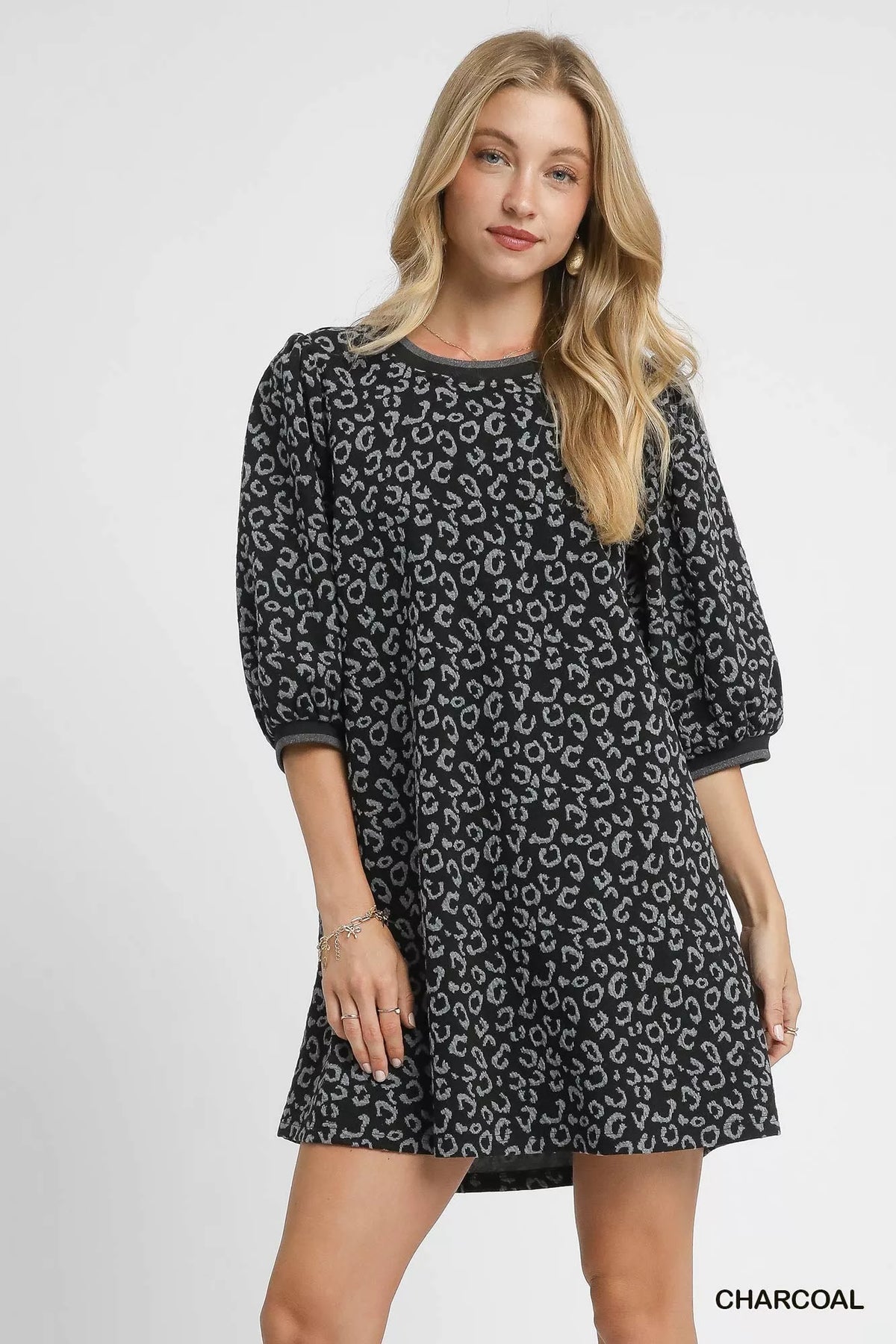 Trendy Umgee leopard print jacquard mini dress with long sleeves and fitted silhouette, showcasing stylish fashion for women.
