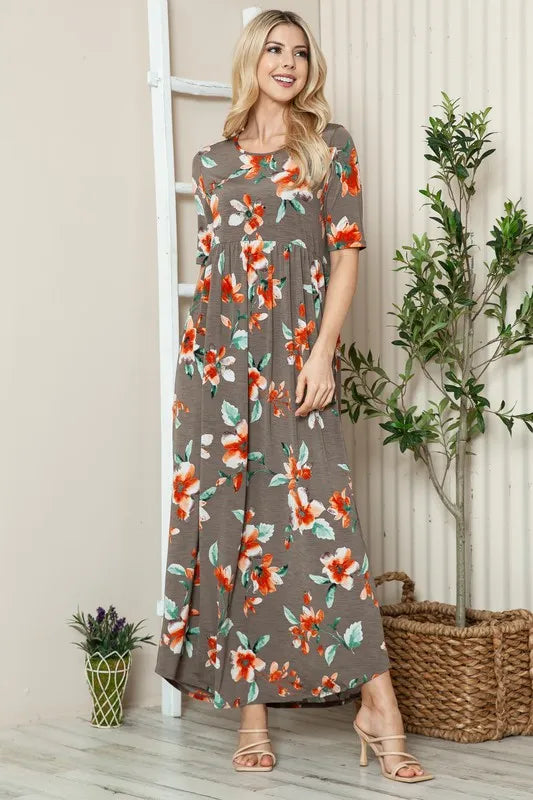 Floral BOMBOM maxi tee dress with round neckline and short sleeves by Trendsi, showcased in a vibrant, floral pattern.