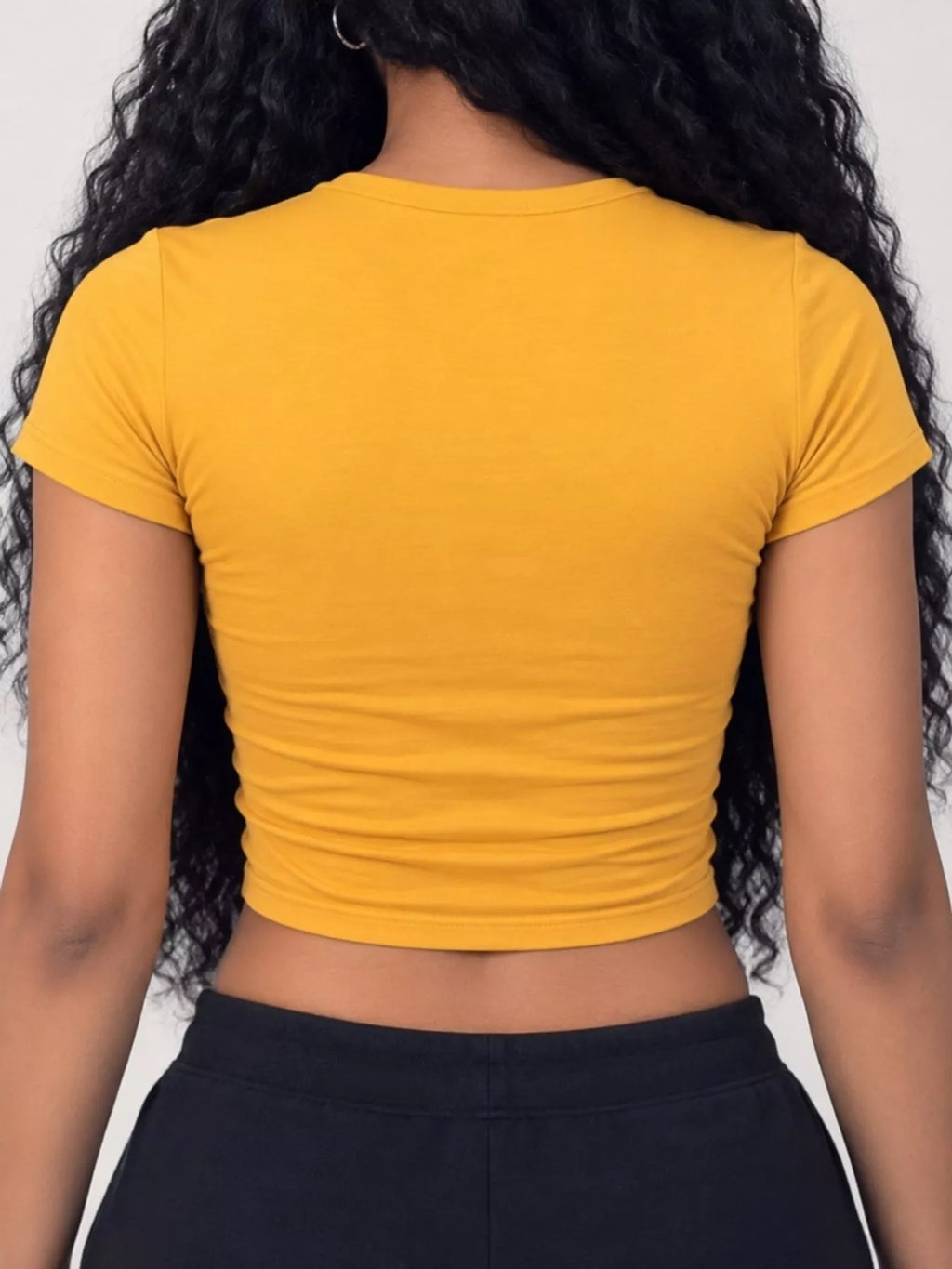 Slim fit basic crew neck short sleeve crop T-shirt by Trendsi, shown in white with a fitted silhouette and cropped length.