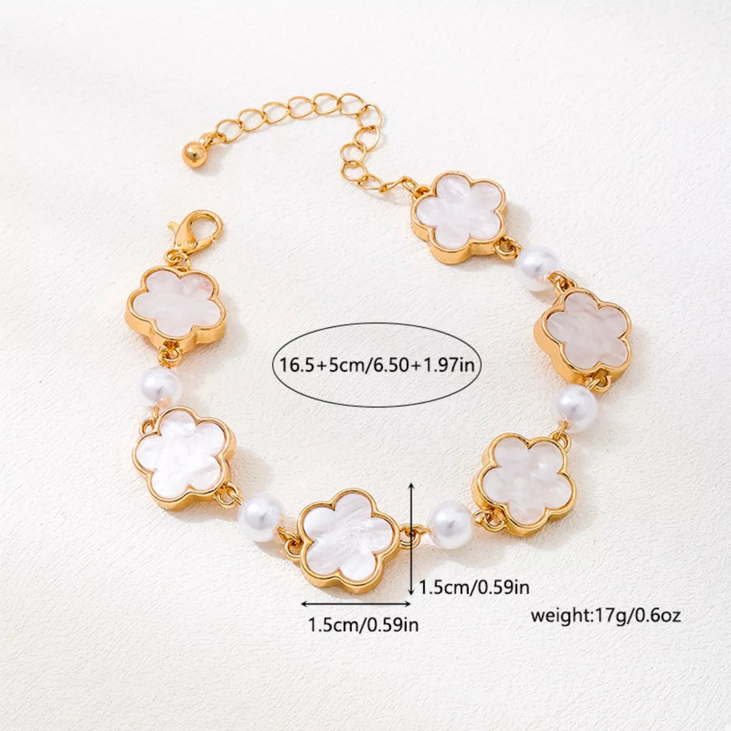Gold-plated alloy flower bracelet with delicate floral design, perfect for elegant jewelry styling.