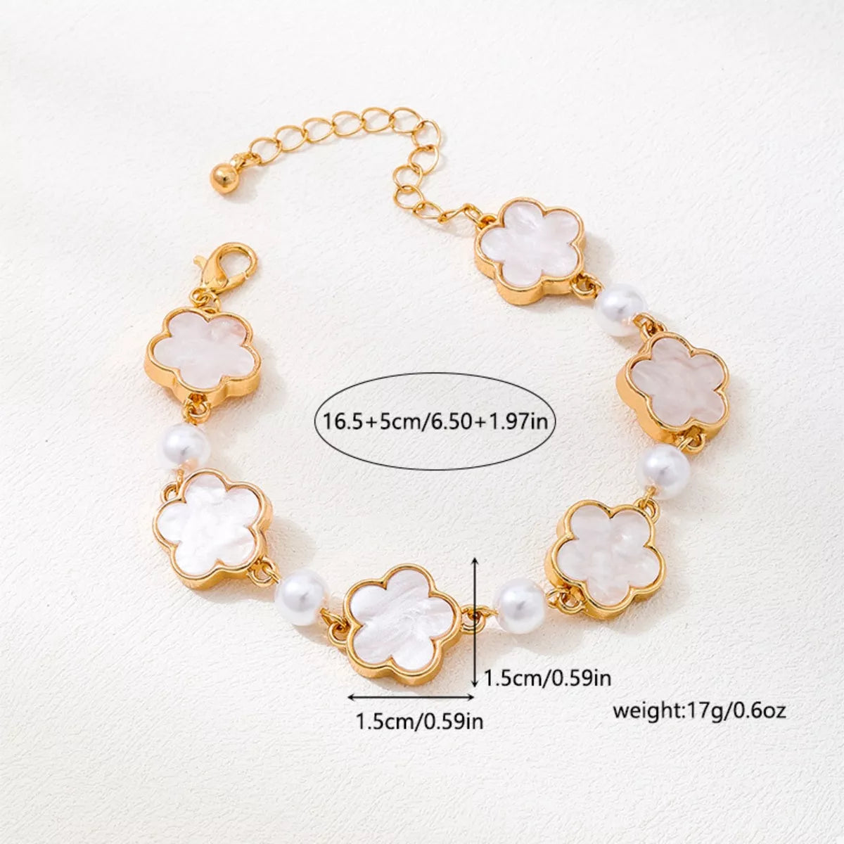 Gold-plated alloy flower bracelet with delicate floral design, perfect for elegant jewelry styling.