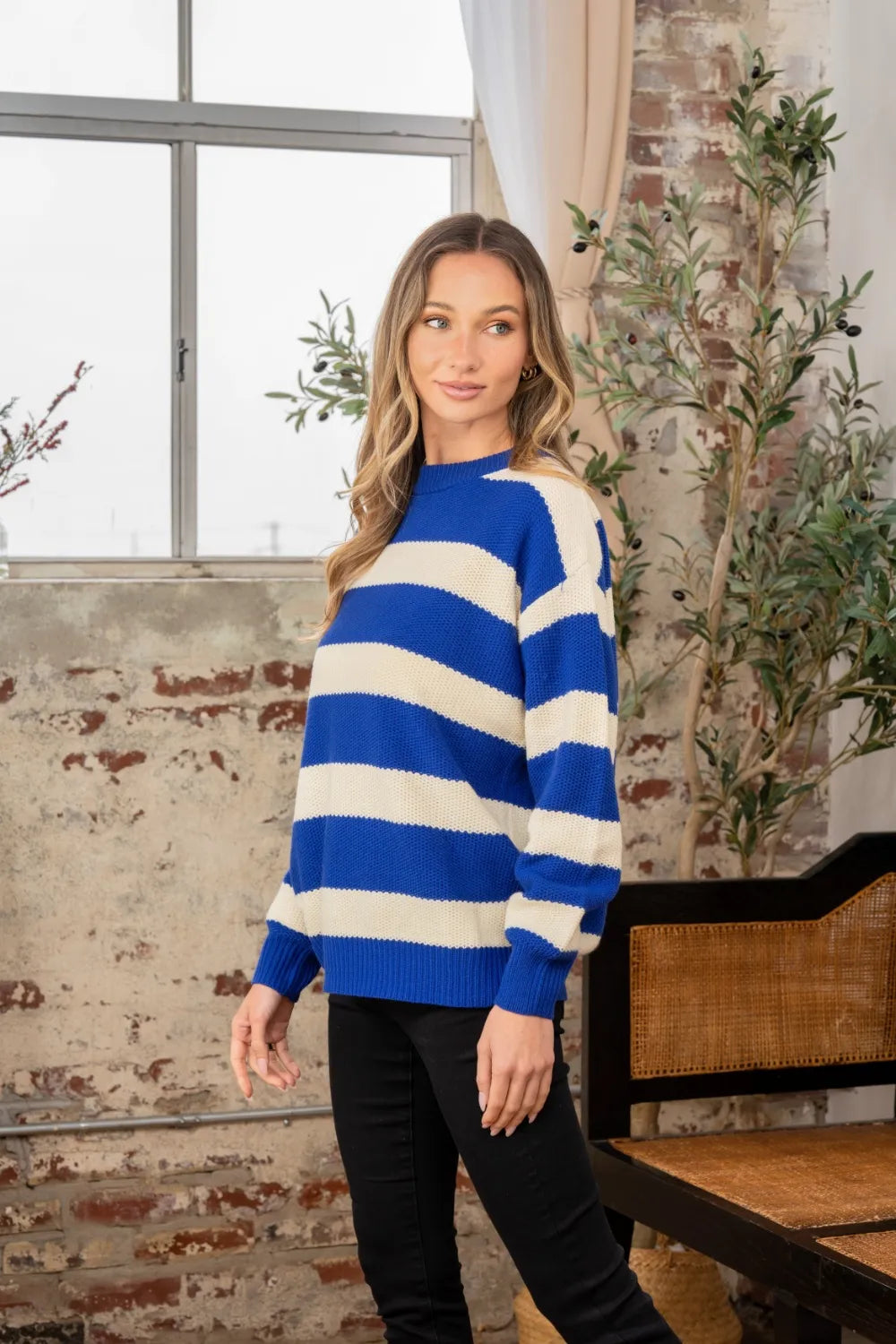 Full size contrast striped round neck sweater by Trendsi, featuring a cozy knit with bold stripe patterns and a classic fit.