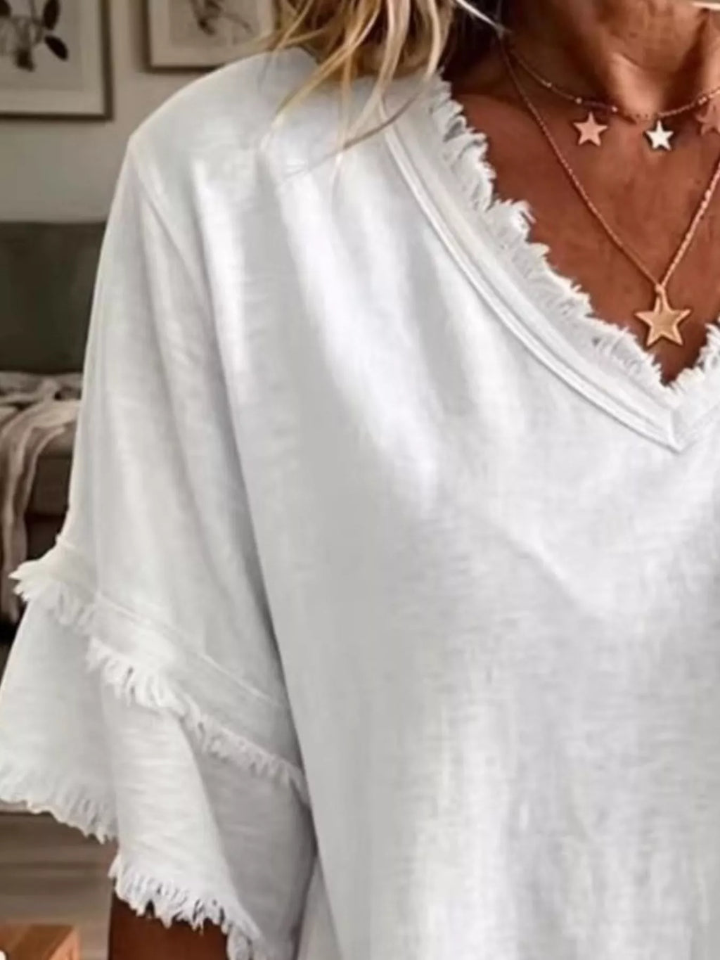 Plus size Trendsi frayed edge V-neck blouse with full size fit, featuring a relaxed fit and stylish frayed neckline.