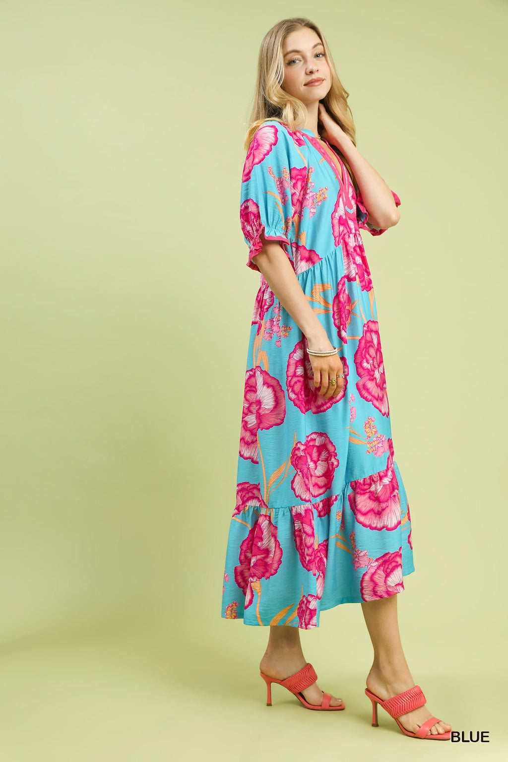 Umgee floral print midi dress with contrast trim, featuring a feminine flowy silhouette and vibrant botanical pattern.