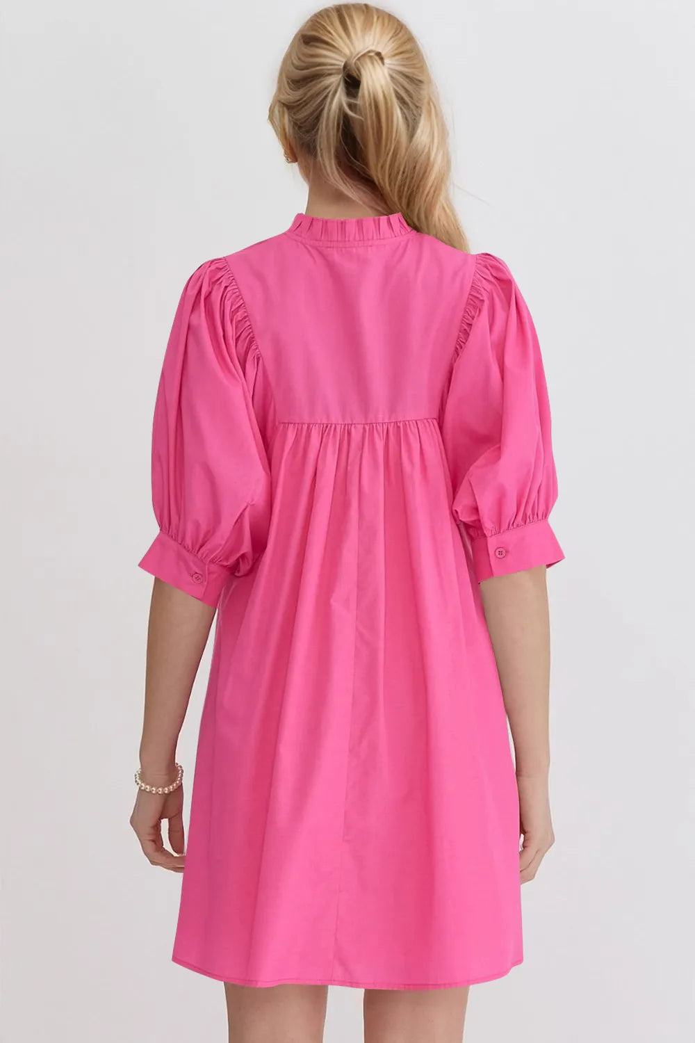 Oh Frill notched puff sleeve babydoll mini dress by Trendsi, featuring ruffled details and a flattering fit in soft fabric.