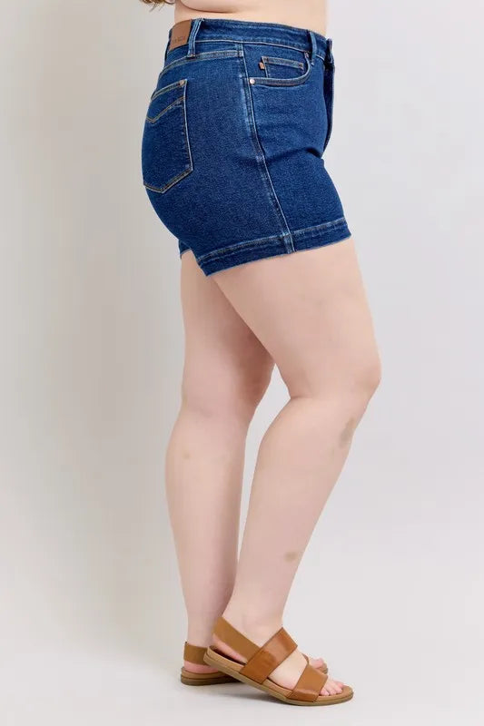 Plus size Judy Blue high waist denim shorts with tummy control, featuring a stylish fit and trendy design.