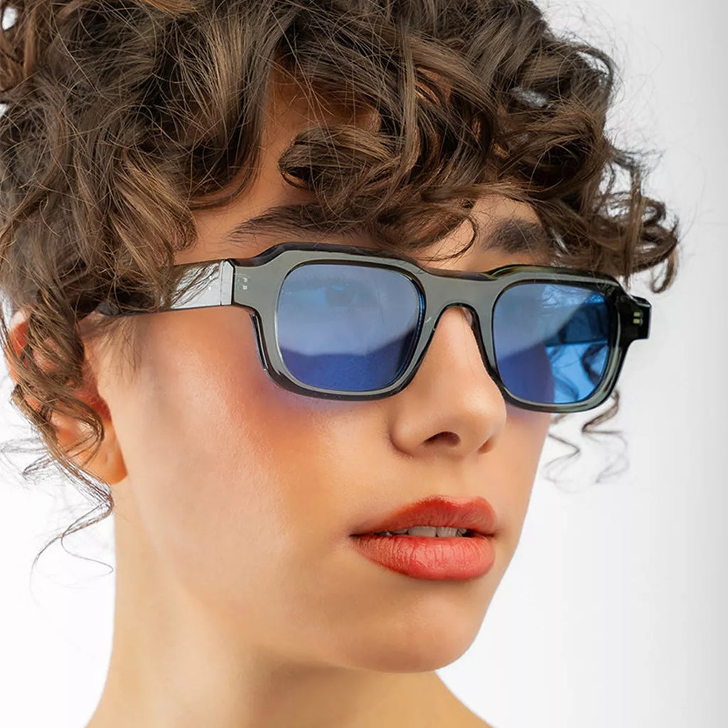 Vintage rectangular sunglasses by Trendsi with dark tinted lenses and sleek black frames, perfect for stylish sun protection.