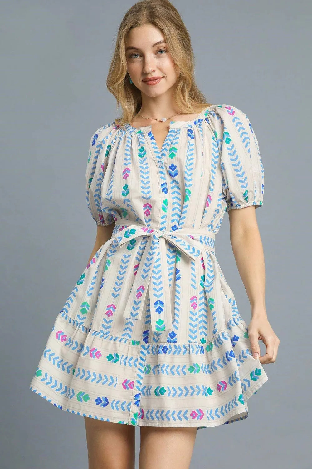 Printed tie waist puff sleeve mini dress by Umgee featuring a flattering fit and stylish design, ideal for casual or dressy occasions.