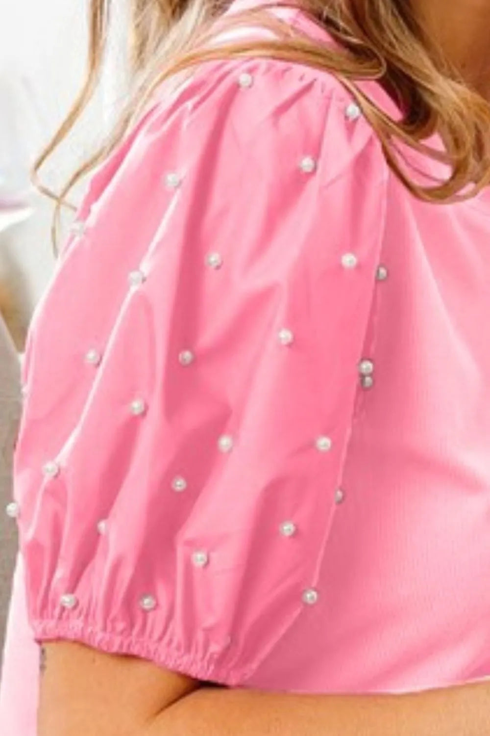 BiBi Pearl Beaded Short Puff Sleeve Top by Trendsi, featuring pearl embellishments and stylish short puff sleeves.