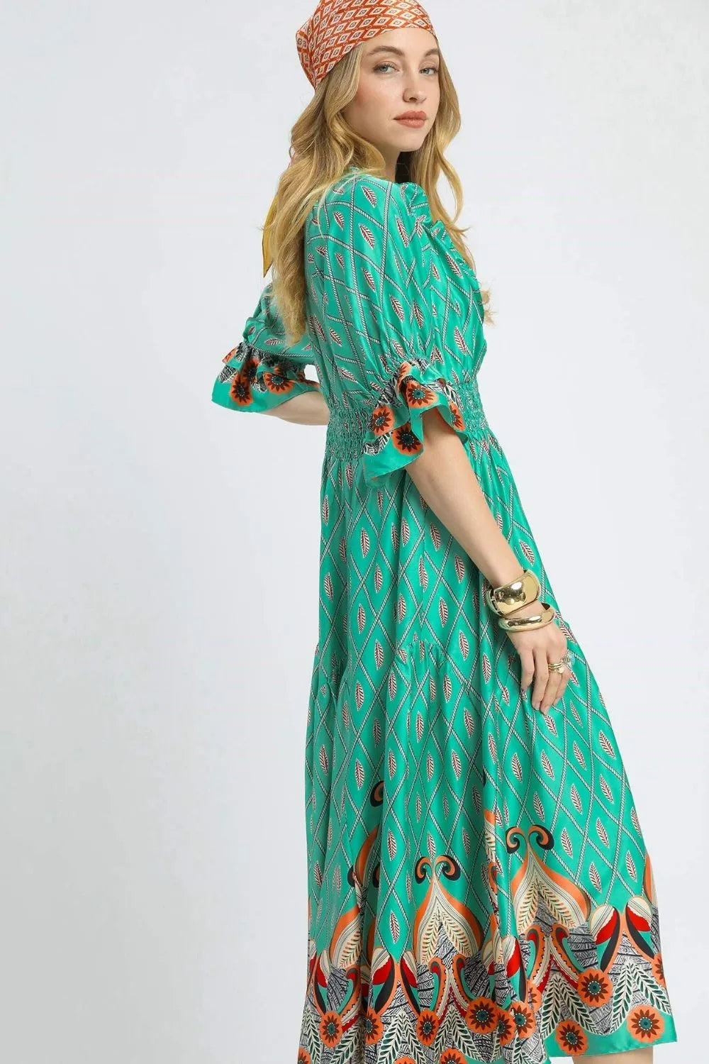 Umgee printed smocked waist flounce sleeve midi dress with a flowy silhouette and vibrant floral pattern.
