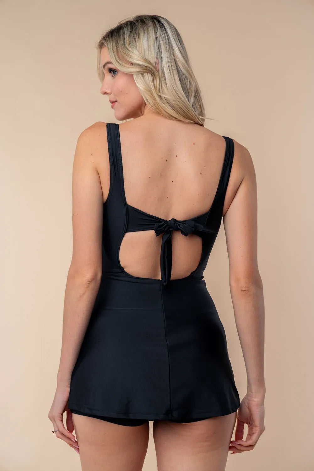 White Birch sleeveless tie-back performance knit swim dress by Trendsi, featuring a full-size, form-fitting design with a stylish back tie.