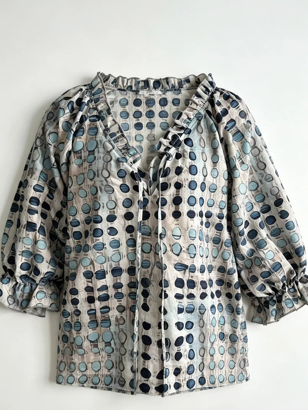 Plus size full-length tie neck blouse with 3/4 sleeves by Trendsi, featuring a stylish and comfortable design.