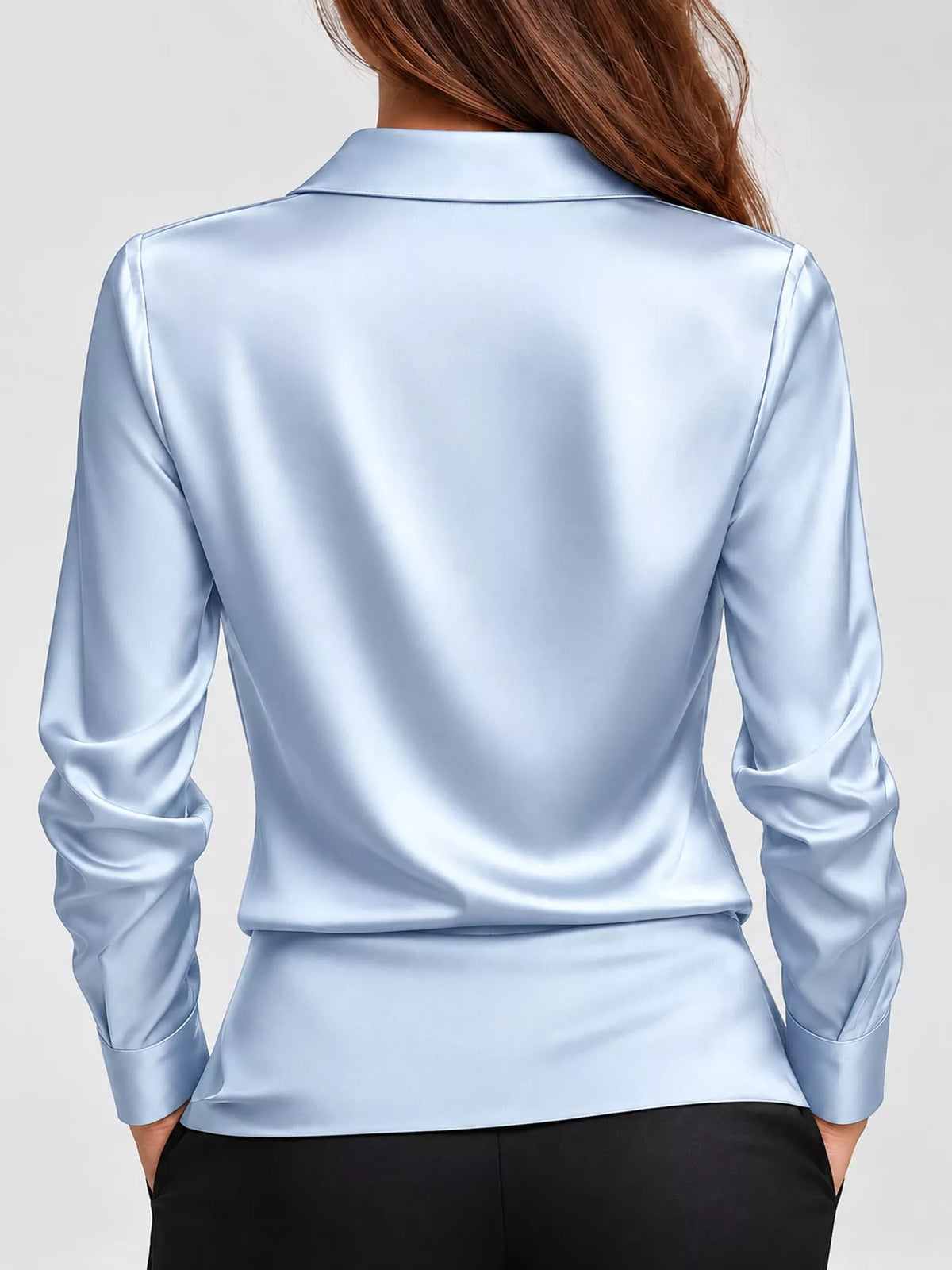 Plus size satin cowl neck blouse by Trendsi, featuring a smooth, shiny fabric and elegant draped neckline, displayed on a hanger.