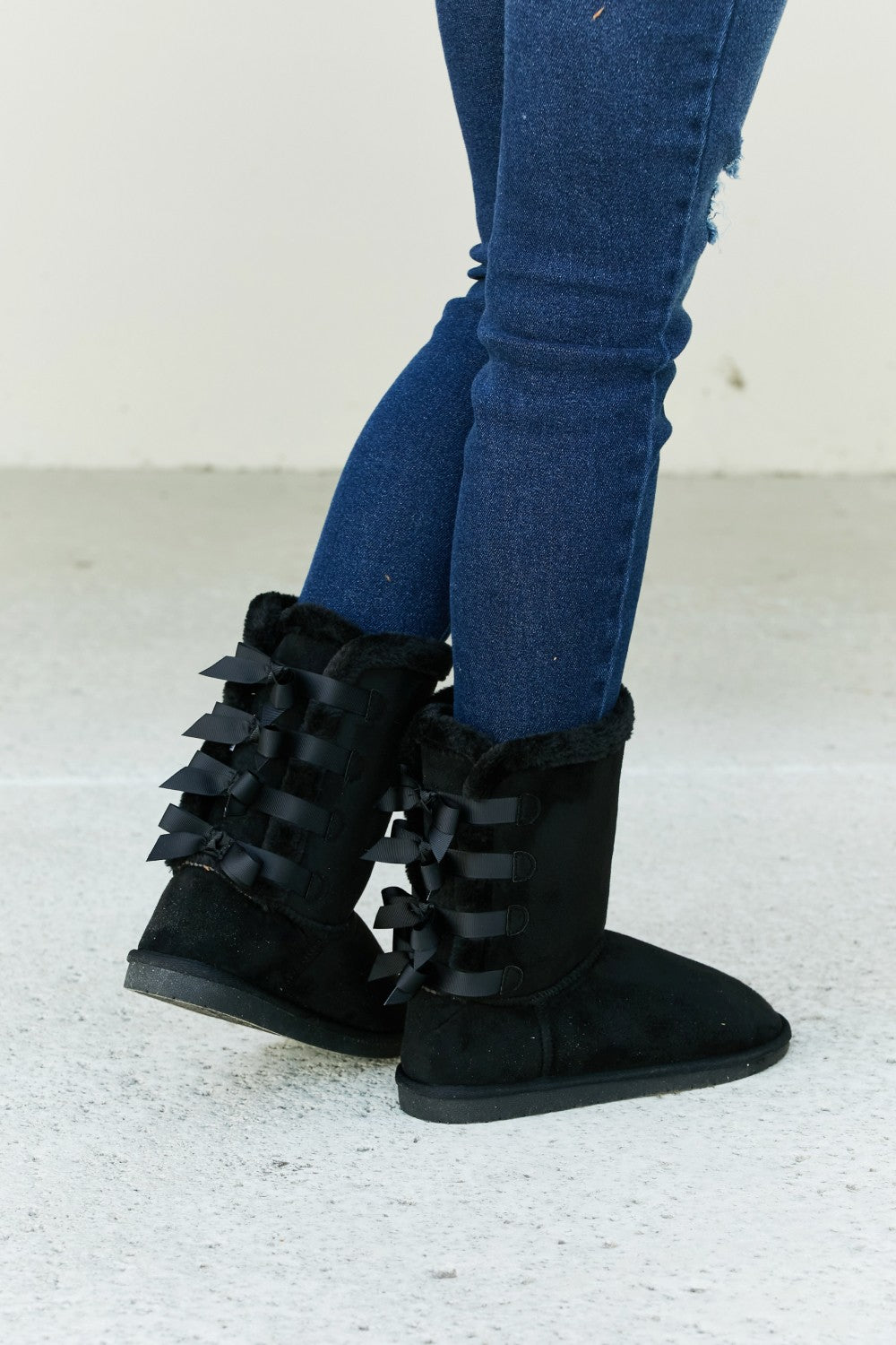 Forever Link Bow Detail faux suede leather snow boots with decorative bow, featuring a sturdy sole and stylish winter footwear design.