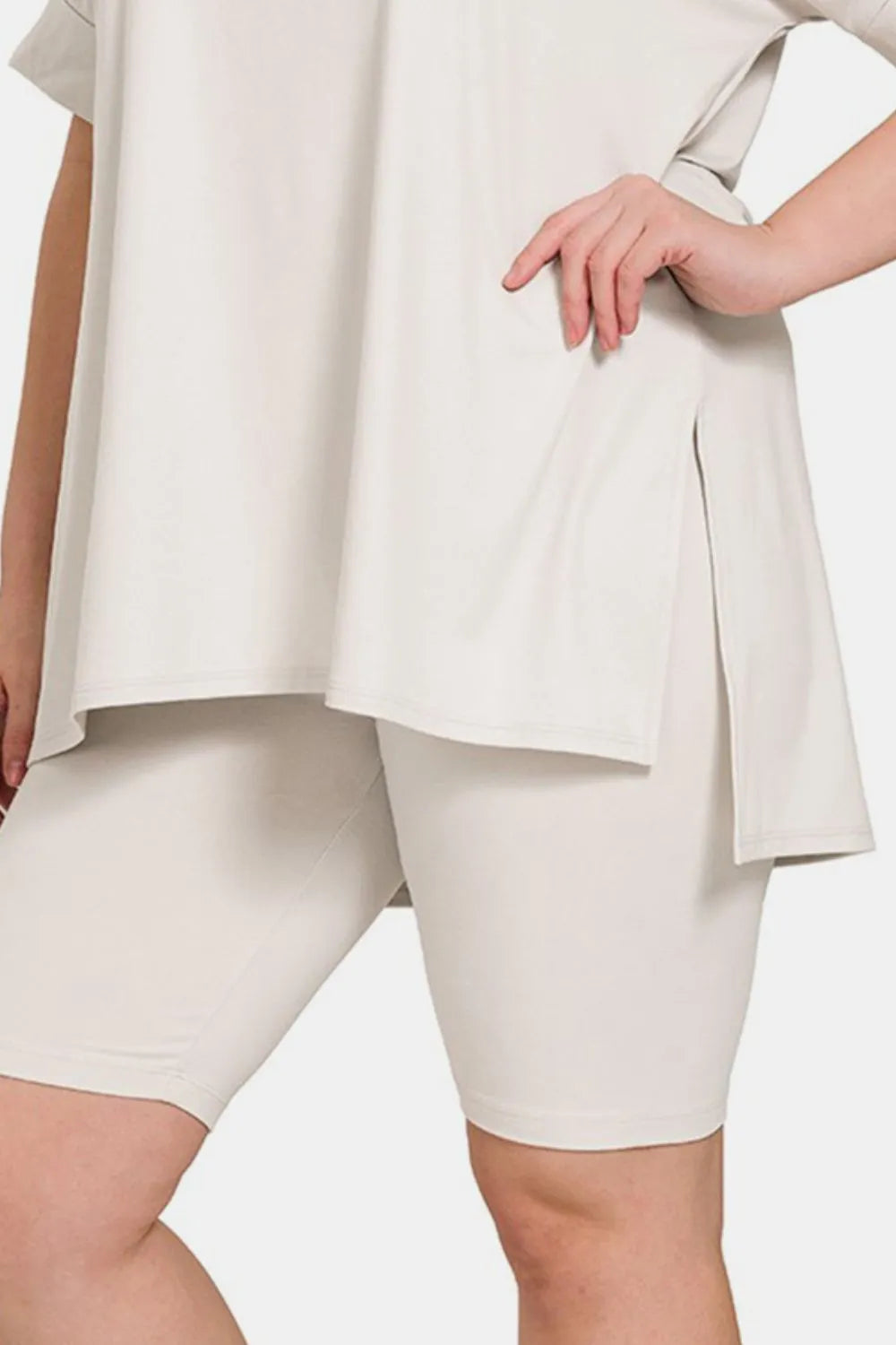 Zenana V-neck short sleeve T-shirt and shorts set with slit design, casual trendy loungewear from Trendsi, shown in natural fabric detail.