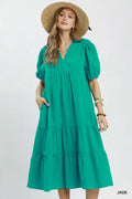 Umgee solid tiered midi dress in a flowing design, featuring multiple layers and a relaxed fit, perfect for casual or semi-formal wear.
