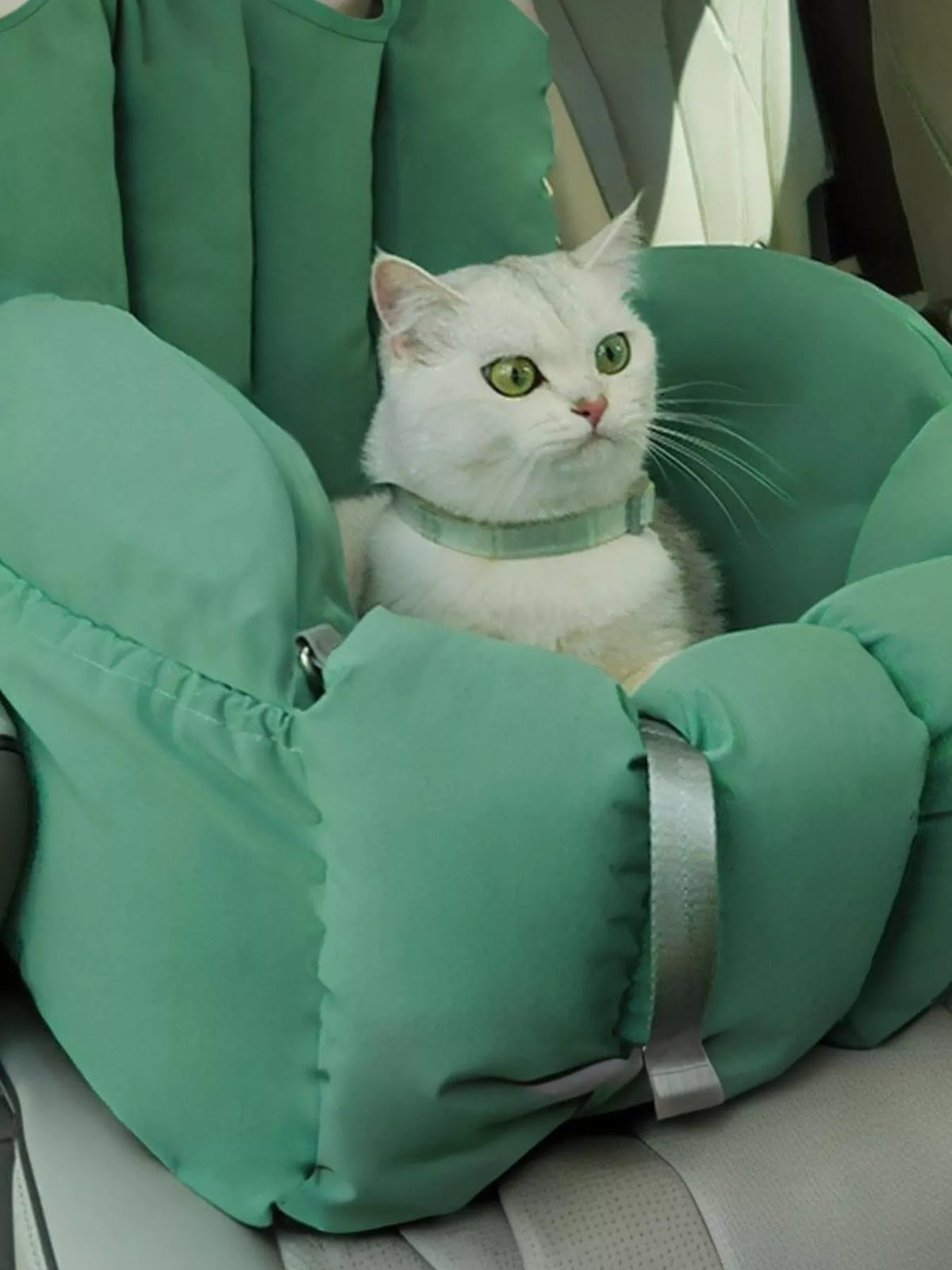 Comfortable and portable pet car nest by Trendsi, shown in soft fabric with cozy interior and secure side support for travel comfort.
