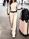 Contrast side stripes top and pants set by Trendsi, featuring a stylish matching two-piece with bold stripe details.