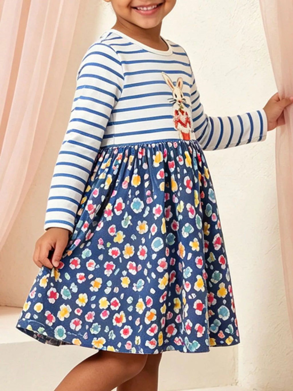 Children's bunny graphic striped floral print dress by Trendsi, featuring colorful floral pattern and playful bunny design.