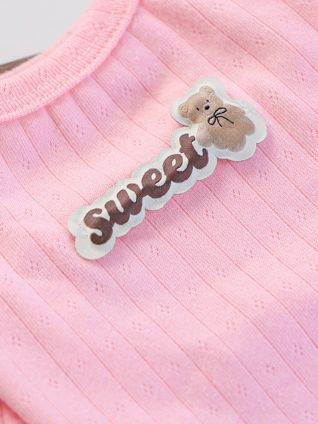 Ribbed pet top with sweet bear patch by Trendsi, featuring a cozy, stylish design suitable for small dogs or cats.
