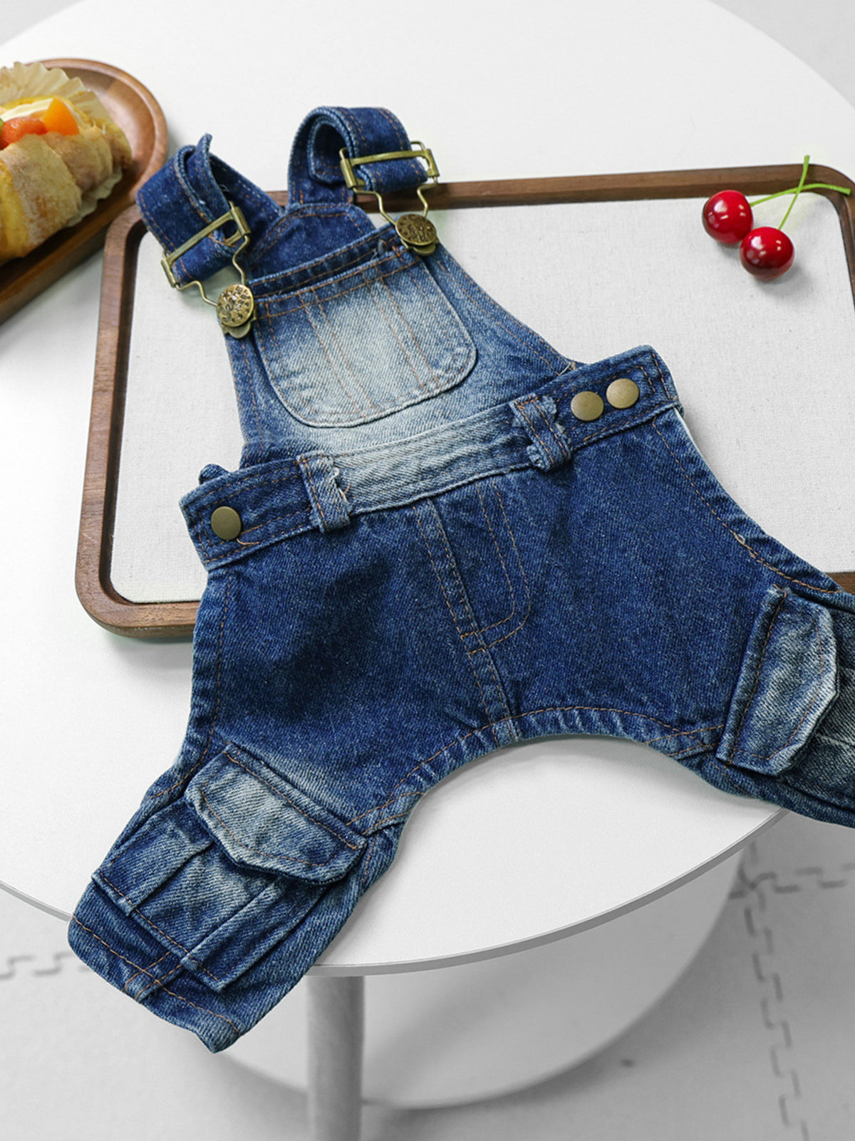 Trendsi denim pet overalls featuring adjustable straps, pockets, and a stylish fit for small dogs or cats.