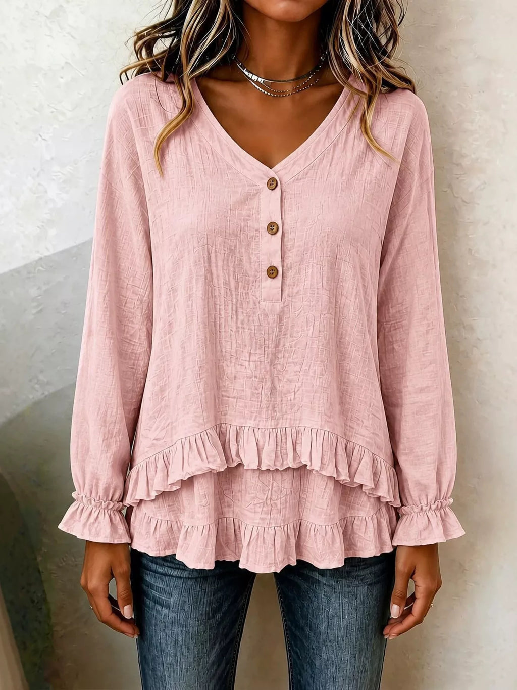 Long sleeve blouse with ruffled hem in soft fabric, featuring a stylish design from Trendsi.