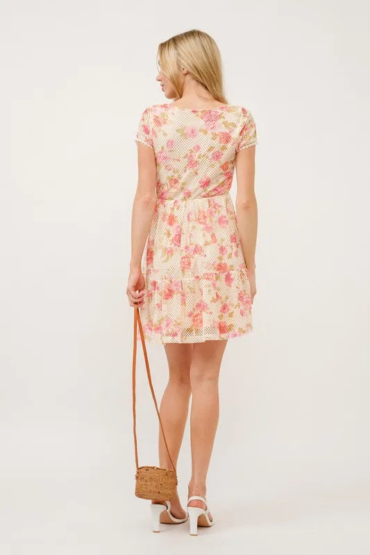 Square neck floral fishnet dress by Trendsi featuring tiered design and feminine floral pattern on lightweight fabric.