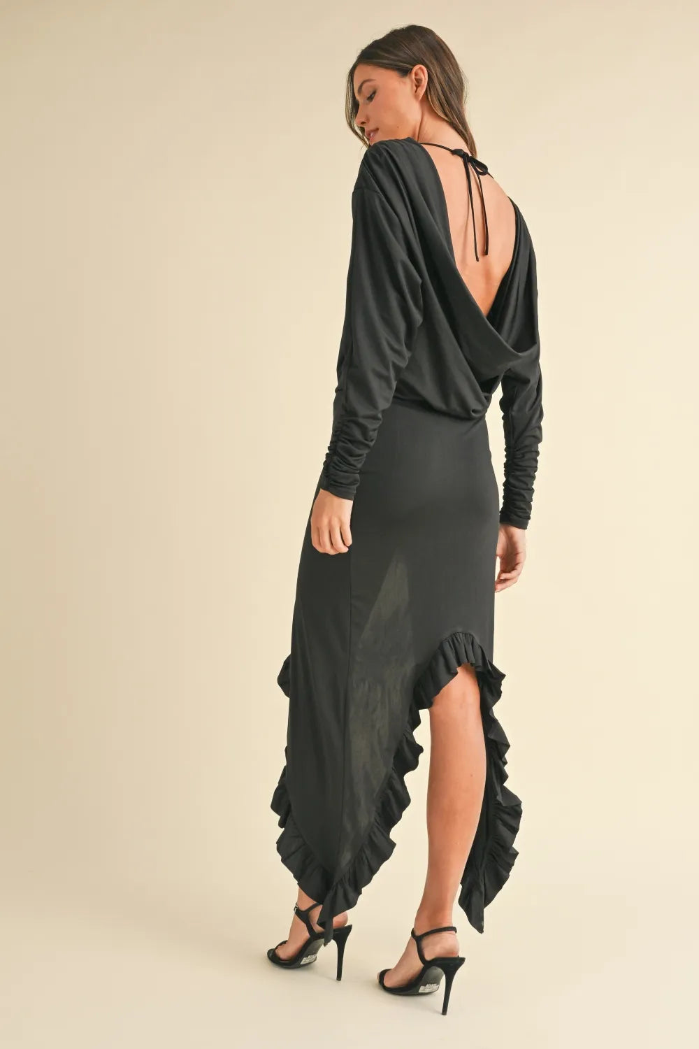 Backless asymmetric ruffle hem dress by Trendsi featuring a stylish Mable design and flowing ruffle details.
