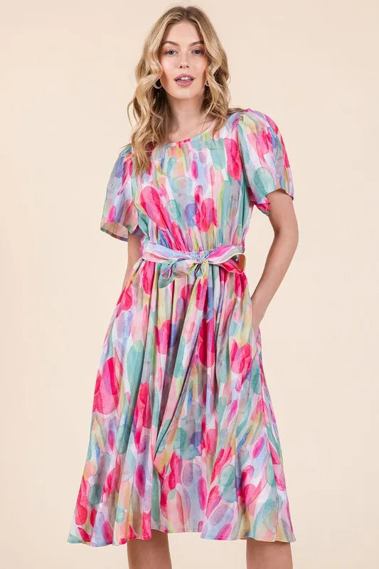 Lime 'N' Chili watercolor print midi dress with tie front from Trendsi, featuring vibrant colors and a flowing silhouette.