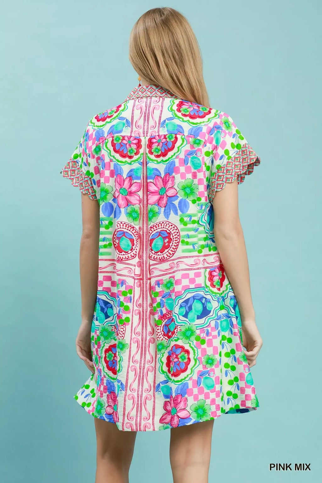 Umgee Mediterranean print dress with contrast printed trim, featuring a flowing silhouette and vibrant, boho-inspired design.