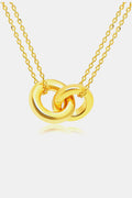 Linked ring pendant chain necklace by Trendsi featuring a sleek metallic chain with a circular linked pendant.