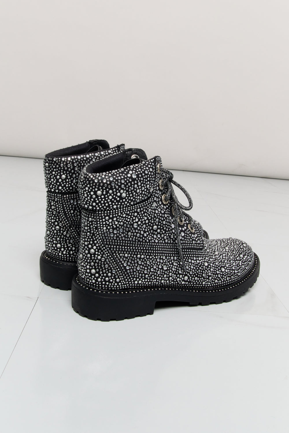 Forever Link rhinestone lace-up combat boots with studded details and chunky soles, stylish footwear by Trendsi.